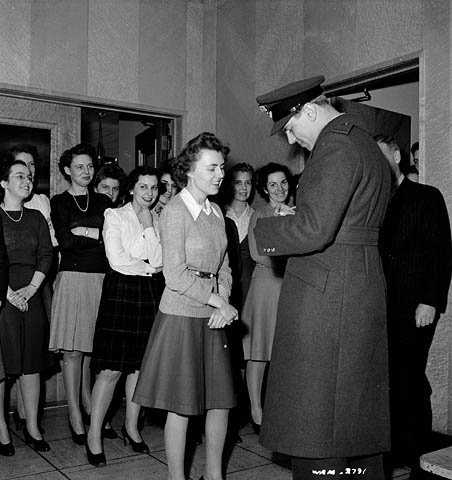 Buzz Beurling signing an autograph for a young woman in 1943