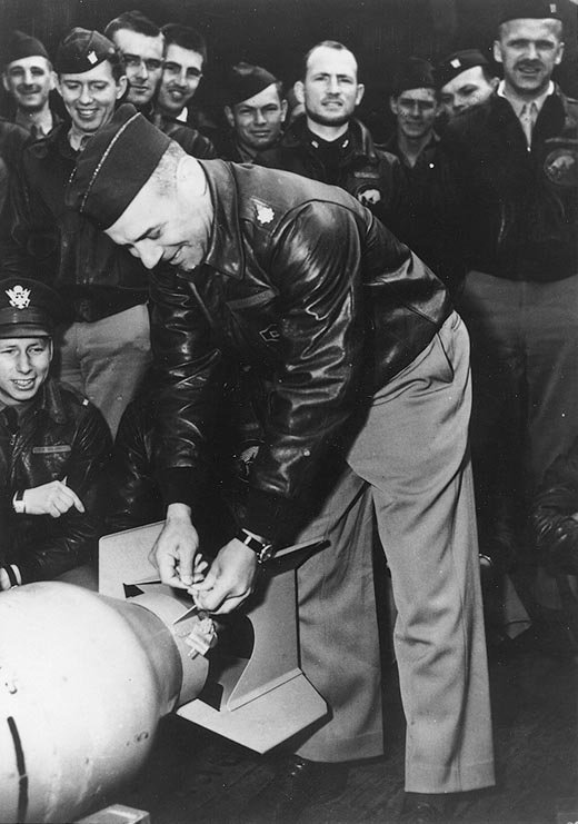 Doolittle wiring Japanese medals to a bomb aboard USS Hornet