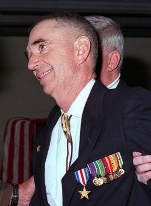 Lieutenant General Paul Van Riper congratulates Carlos Hathcock after presenting the Silver Star, 1996