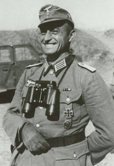 Major Josef Gangl talking with Lieutenant John C. Lee beside his car before the defence of Castle Itter