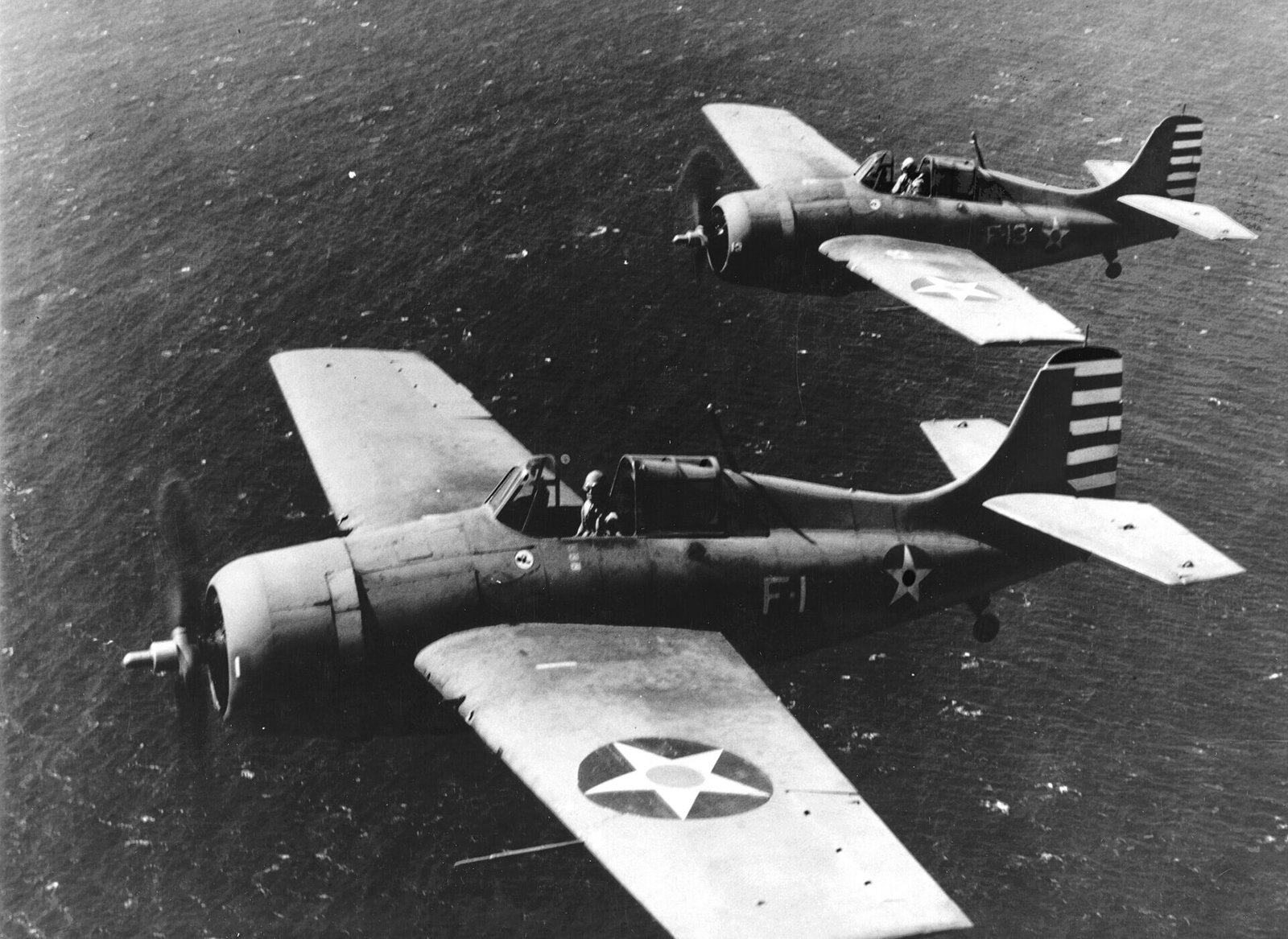 Two Grumman F4F-3 Wildcats of Fighting Squadron 3 in flight off Oahu, 10 April 1942